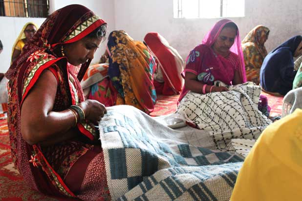 Craftswomen weaving rugs for Gan in India. Photo courtesy of Gan.