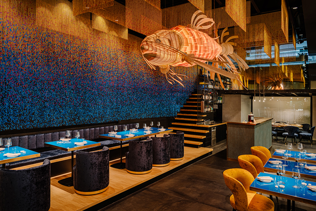 Koi light sculpture by LZF lamps and the artistic decorative chains from Kriskadecor at the Kohakinho sushi bar. Photo courtesy of Kriskadecor.