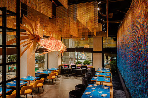Koi light sculpture by LZF lamps and the artistic decorative chains from Kriskadecor at the Kohakinho sushi bar. Photo by FTFOTO, courtesy of LZF lamps.
