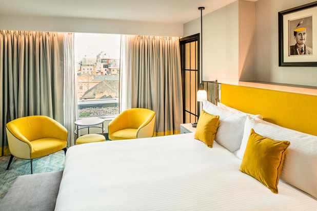 Armchairs, side tables and bed footstool by Mobilfresno in rooms at the Dixon Marriot Hotel in London. Photo: Courtesy of Mobilfresno