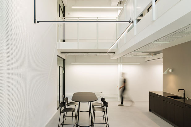 Sticks architectural luminaire by Arik Levi for Vibia at the SIG’s company headquarters in Neuhausen, Switzerland. Photo by Andrin Winteler, courtesy of Vibia.